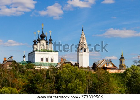 Russia, Vladimir region, Suzdal, Alexander convent, July 22, 2014 - view from the Pokrovsky monastery, sunny summer day, blue sky, church and bell tower