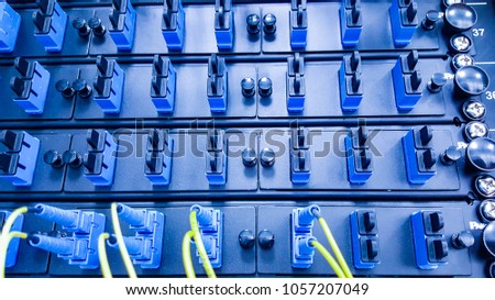 Close up fiber optic in server room , network cables installed in rack
