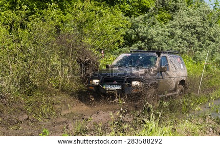 Lvov, Ukraine - May 30, 2015: Off-road vehicle Nissan  overcomes the track on  of   landfill near the city  Lvov, Ukraine.