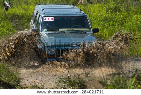 Lvov, Ukraine - May 30, 2015: Off-road vehicle Jeep Cherokee (No 449) overcomes the track on of landfill near the city Lvov, Ukraine.