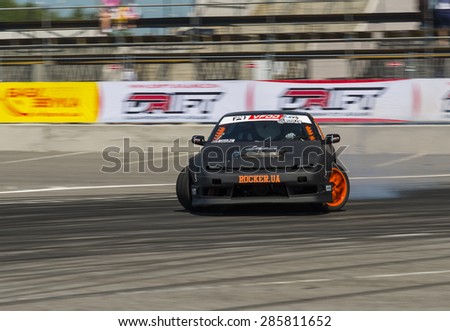 Lvov, Ukraine - June 6, 2015: Unknown rider on the car brand Nissan overcomes the track in the championship of Ukraine drifting in Lvov, Ukraine.