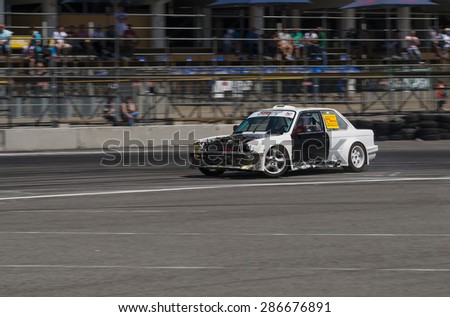 Lvov, Ukraine - June 6, 2015: Unknown rider on the car brand Nissan overcomes the track in the championship of Ukraine drifting in Lvov,Ukraine.