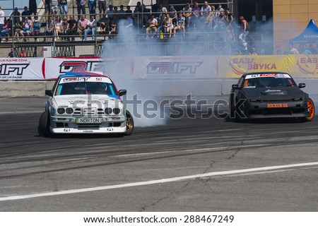 Lvov, Ukraine - June 7, 2015:  Rider Dmytro ILLYUK on the car brand Nissan overcomes the track in the championship of Ukraine drifting in Lvov, Ukraine.