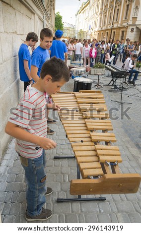 Lvov, Ukraine -  21 June 2015 :Boy playing xylophone on urban music festival in the city center Lvov.