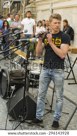 Lvov, Ukraine -  21 June 2015 :Musician checks microphones on urban music festival in the city center Lvov.