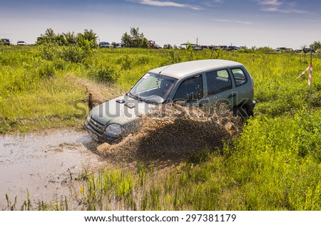 Lvov, Ukraine - May 30, 2015: Off-road vehicle  NIVA - Chevrolet (No. 333) overcomes the track on of landfill near the city Lvov.