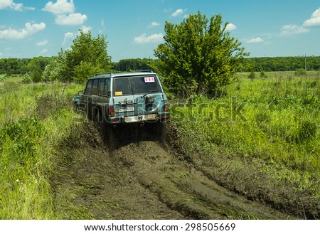 Lvov, Ukraine - May 30, 2015: Off-road vehicle Nissan Patrol overcomes the track on of landfill near the city Lvov.