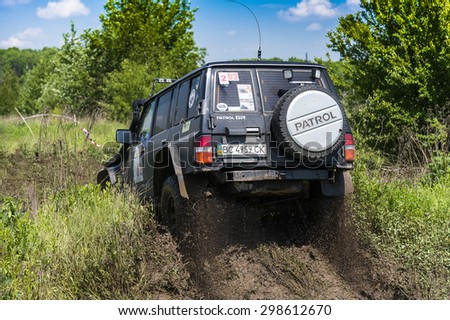 Lvov, Ukraine - May 30, 2015: Off-road vehicle Nissan Patrol overcomes the track on of landfill near the city Lvov.