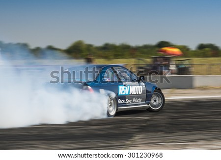 Vinnytsia,Ukraine-July 24, 2015: Unknown rider  on the car brand BMW overcomes the track in the  Drift championship of Ukraine  on July 24,2015 in Vinnytsia, Ukraine.
