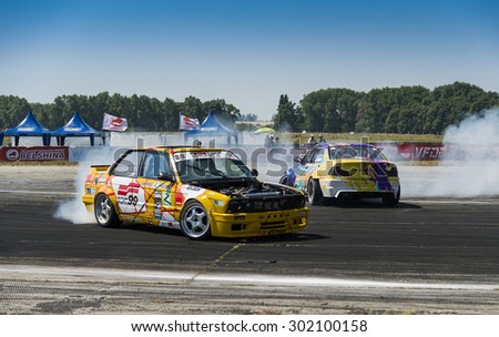 Vinnytsia,Ukraine-July 25, 2015: Riders  on the cars brand BMW   makes a mistake on the track in the  Drift championship of Ukraine  on July 25,2015 in Vinnytsia, Ukraine.