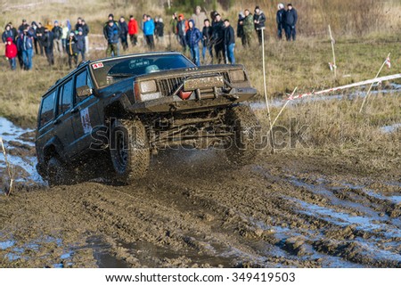 Lviv,Ukraine- December 6, 2015: Unknown rider on the off-road vehicle brand Jeep Cherokeel overcomes a route off road at Zub - Trial 2015 near the city of Lviv, Ukraine