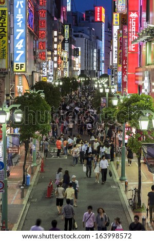 Tokyo, Japan - June 26, 2010: The brigtly lit street with crowds of people in East Shinjuku on 26 June 2010 in Tokyo, Japan. East Shinjuku is an important entertainment district in Tokyo.