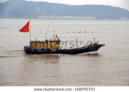East China Sea, China - July 19, 2007: Small fishing boat sailing east china sea on Juy 19, 2009.