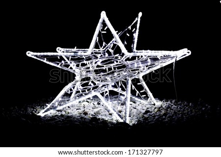 Christmas street decoration - star made of light bulbs fitted to metal skeleton