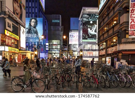 Osaka Japan - June 20, 2010: Bicycle parked in Dotombori district in the background of neon lights on June 20, 2010 in Osaka, Japan. Dotombori is the main entertainment district in Osaka.