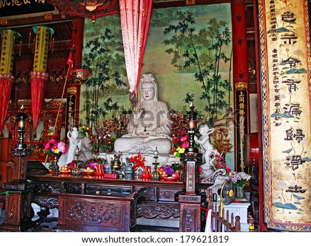 Putuoshan, China - July 17, 2007: Colorful buddhist altar at a temple on Putuo Island on July 17, 2007. Putuoshan island of the 4 holy mountains of buddhism.