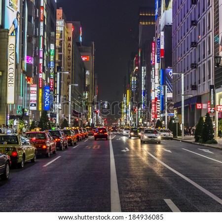 Tokyo, Japan - June 28, 2010: Rows of taxies parked at late night in Ginza district on 28 June 2010. Ginza is the most expensive and posh entertainment district in Tokyo.