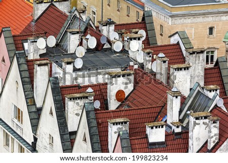 Steep red roofs of an old part of town covered with satellite dishes, Wroclaw Poland