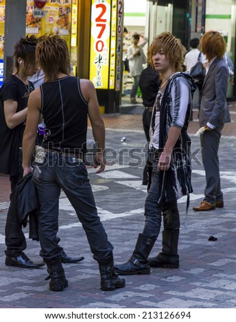 Tokyo, Japan - June 26, 2010: A group of Japanese male hosts are looking for potential clients in Kabukicho, a red lantern district in Tokyo on June 26, 2010.