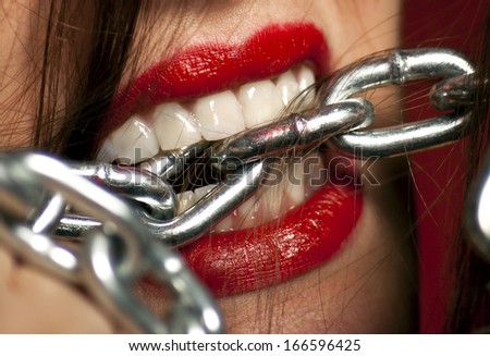 Close Up of Woman's Mouth with Chains