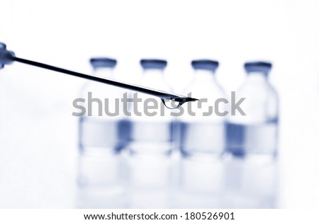 Glass Medicine Vials and botox, hualuronic, collagen or flu Syringe on a white background