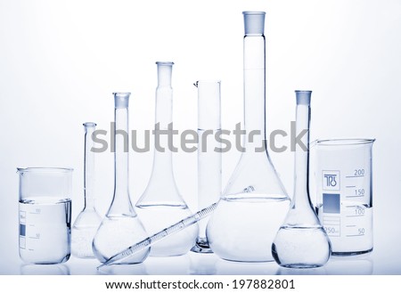 Test-tubes with reflections on a white and blue background. Laboratory glassware.