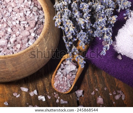 Spa background with bunch of lavender and purple sea salt.