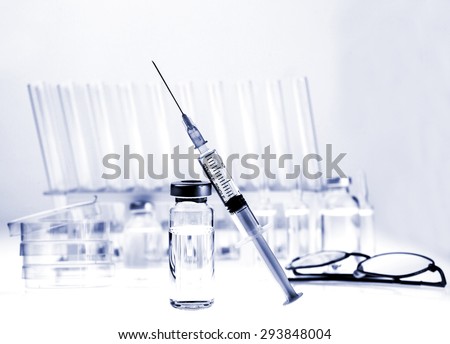 Test-tubes on a white and blue background. Laboratory glassware.