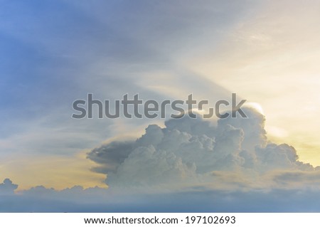 mid-level clouds against a blue sky. clouds is in a curved formation similar to a turtle