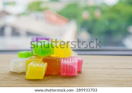 colorful of Thai dessert crispy jelly, on wood board and background out of focus