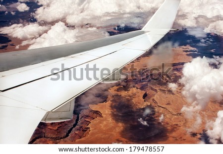 View to a Grand Canyon from a plane.You can use the wing for a logo.Please let me know where will you use the picture.Thank you