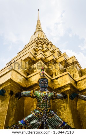 The demon statue supporting golden pagoda at Temple of the Emera