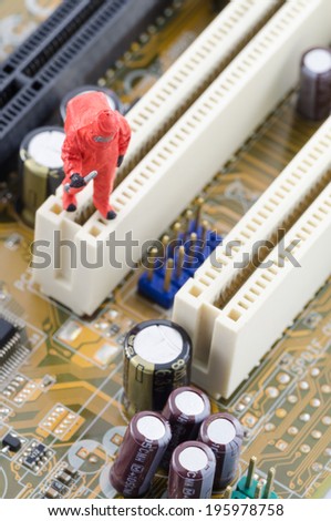 miniature scientist checking toxic on the computer motherboard