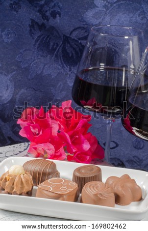 romantic set of chocolates flowers and red wine