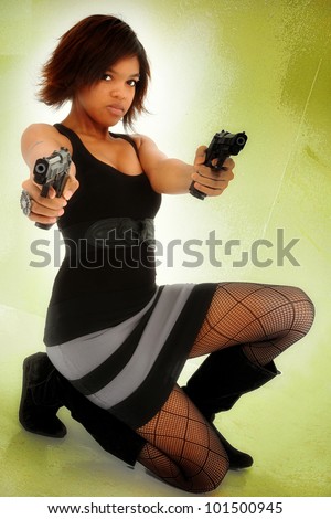 Young Adult Black Woman Defending Self with Guns Exercising Stand Your Ground Gun Law