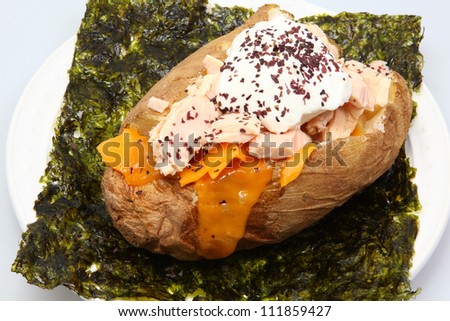 Abacore Tuna stuffed Baked Potato on Seaweed with Dulse Flakes, Cheese and Sour Cream