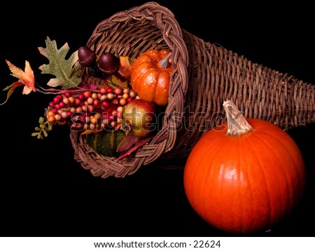 Pumpkin and fall decorations in basket.