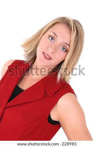 Portrait of a beautiful 21 year old woman in a red sleeveless jacket over white.