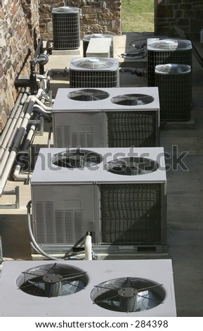 Row of AC/heating units shot from above.