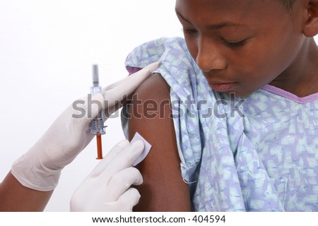 Boy In Hospital Gown About To Get An Injection.