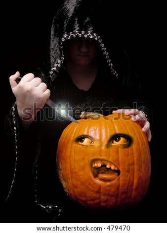 Nothing says Halloween like a good old fashioned pumpkin carving. Black robed creature about to carve into a frightened and enchanted pumpkin as this poor pumpkin gives a wide-eyed gaze at the knife.