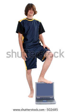 stock photo Barefoot teen Boy Standing with Laptop Computer Over White