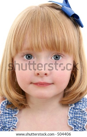 Beautiful Little Girl With Strawberry Blonde Hair with big blue eyes.  Shot in studio over white.