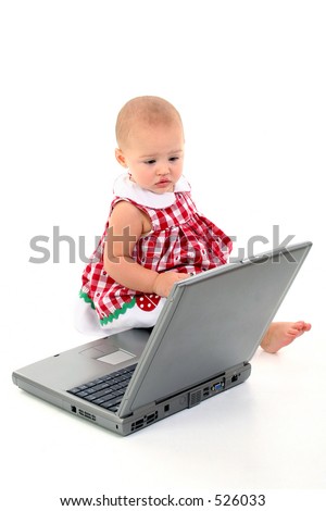 Baby Girl With Laptop Computer Over White. Child has \