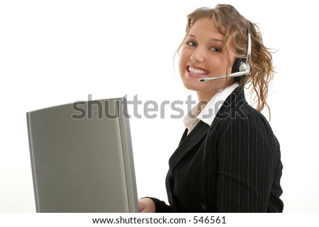 stock photo Beautiful 16 year old teen in suit at laptop wearing headset