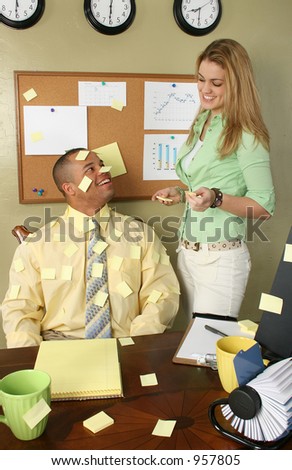 Girl getting covering office worker in yellow stick on note papers.  Blank to add text.  Blank page on cork board to add text.
