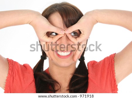 stock-photo-beautfiul-young-woman-making-silly-glasses-with-hands-shot-in-studio-over-white-971918.jpg