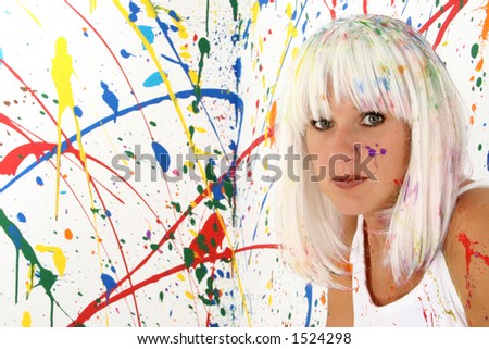 Beautiful 29 year old woman with white hair, white dress, covered in paint.