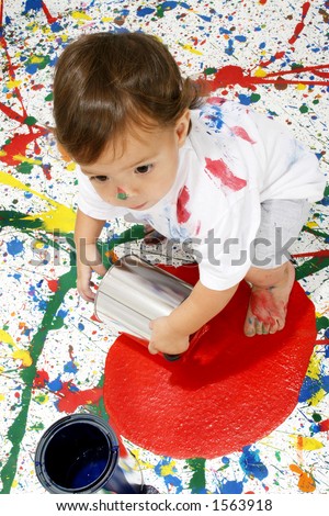 Adorable baby on splattered paint background