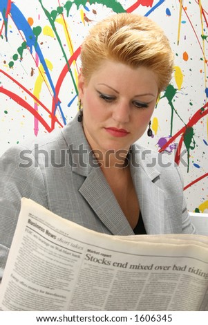 Woman reading newspaper.